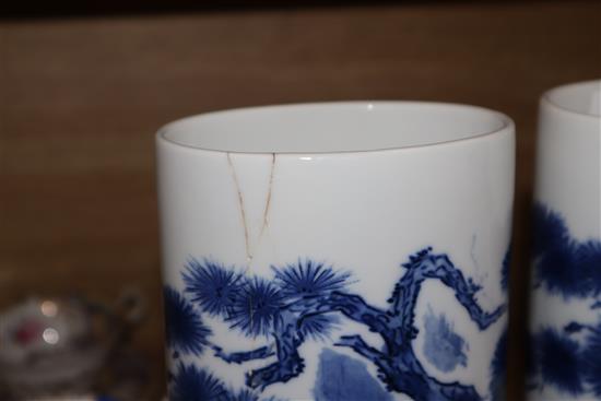 A pair of Chinese blue and white oval section sleeve vases height 25cm (one a.f.)